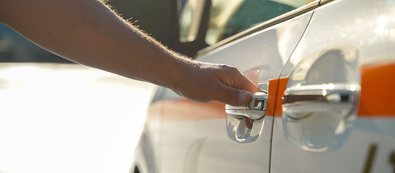 A-Ride Employee Opening Door for Riding Customer